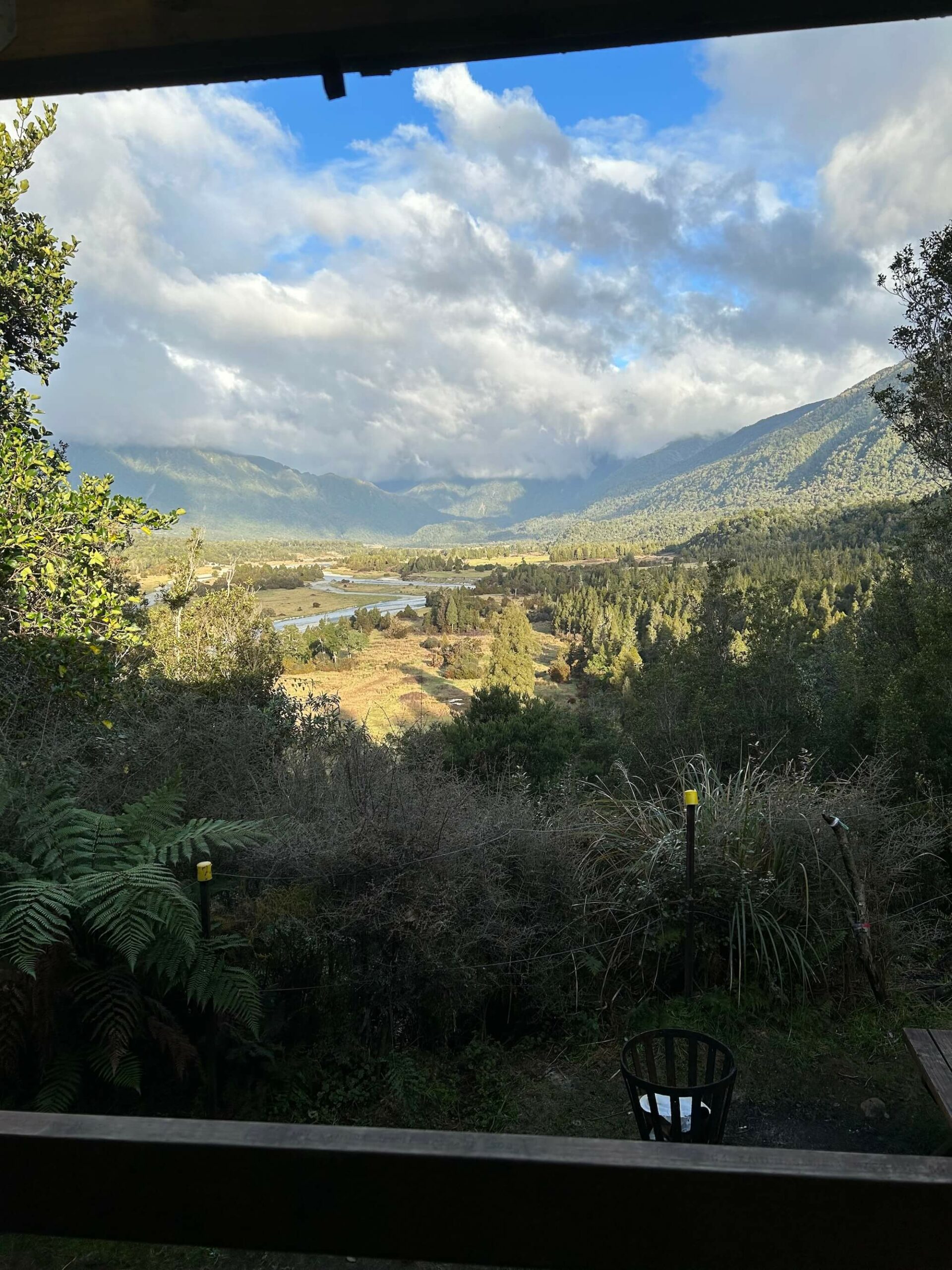 A view of a valley from a window.